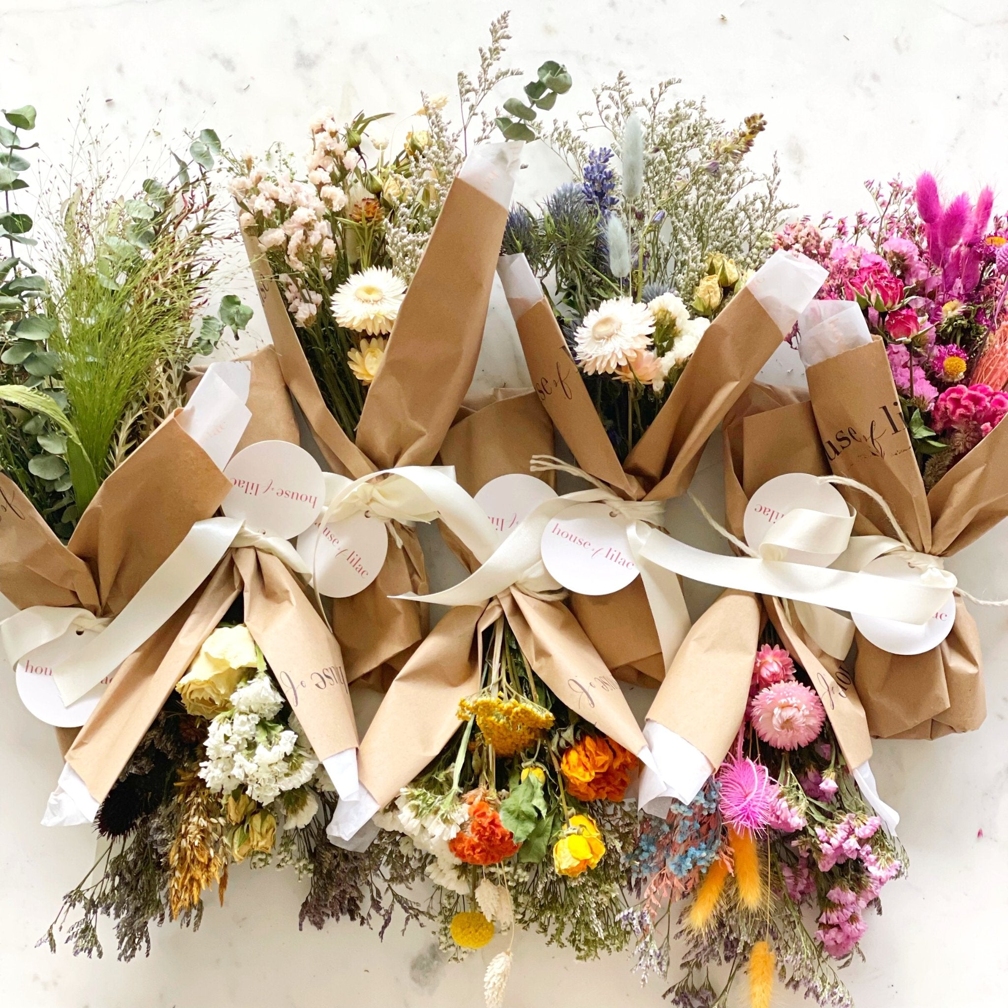 Flower bouquet wrapped in brown paper kept hand Vector Image